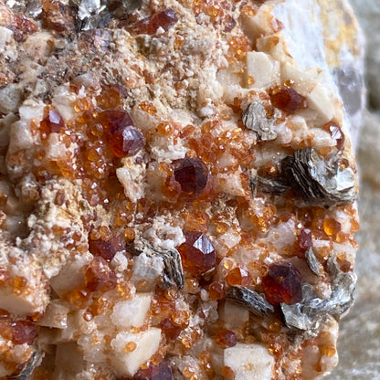 SPESSARTINE GARNET WITH MUSCOVITE ETC FROM CHILAS VALLEY, PAKISTAN. 96g MF1394