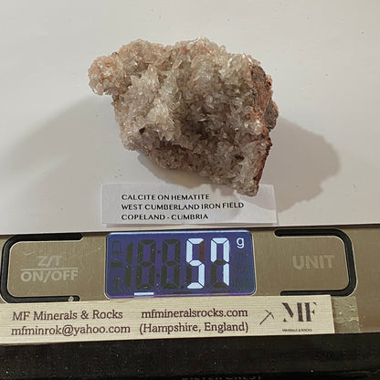 CALCITE ON HEMATITE : WEST CUMBERLAND IRON FIELD, COPELAND, CUMBRIA. 57g MF5354