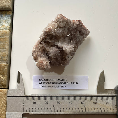 CALCITE ON HEMATITE : WEST CUMBERLAND IRON FIELD, COPELAND, CUMBRIA. 57g MF5354