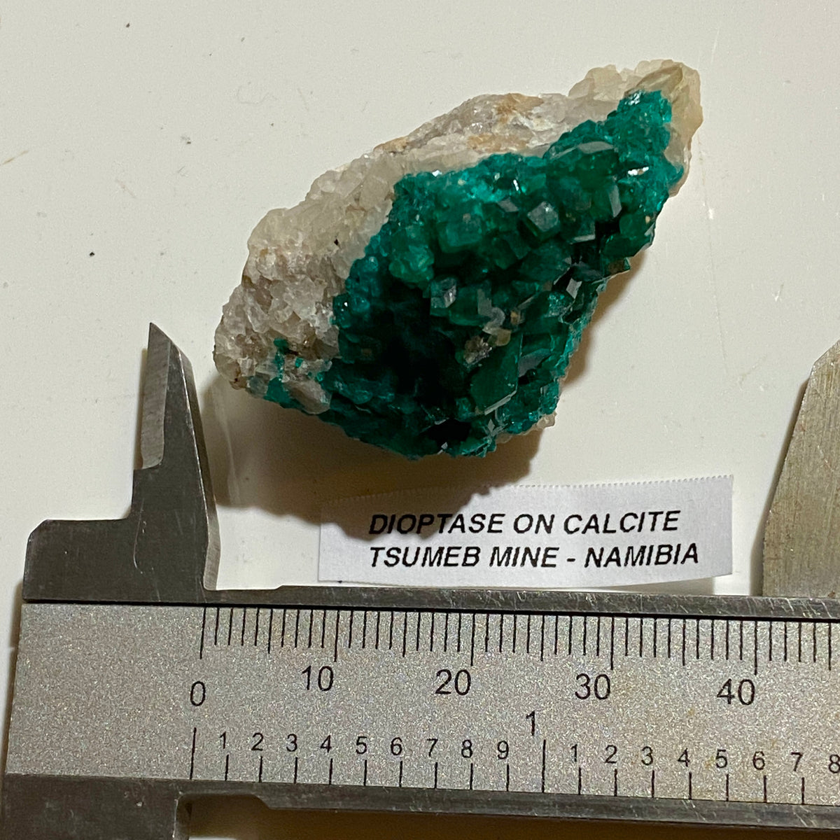 DIOPTASE ON CALCITE : TSUMEB MINE, OSHIKOTO, NAMIBIA. 22g. MF5357