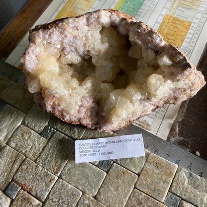 LIMESTONE VUG WITH CALCITE/QUARTZ, DULCOTE, SOMERSET HEAVY 990g MF1491