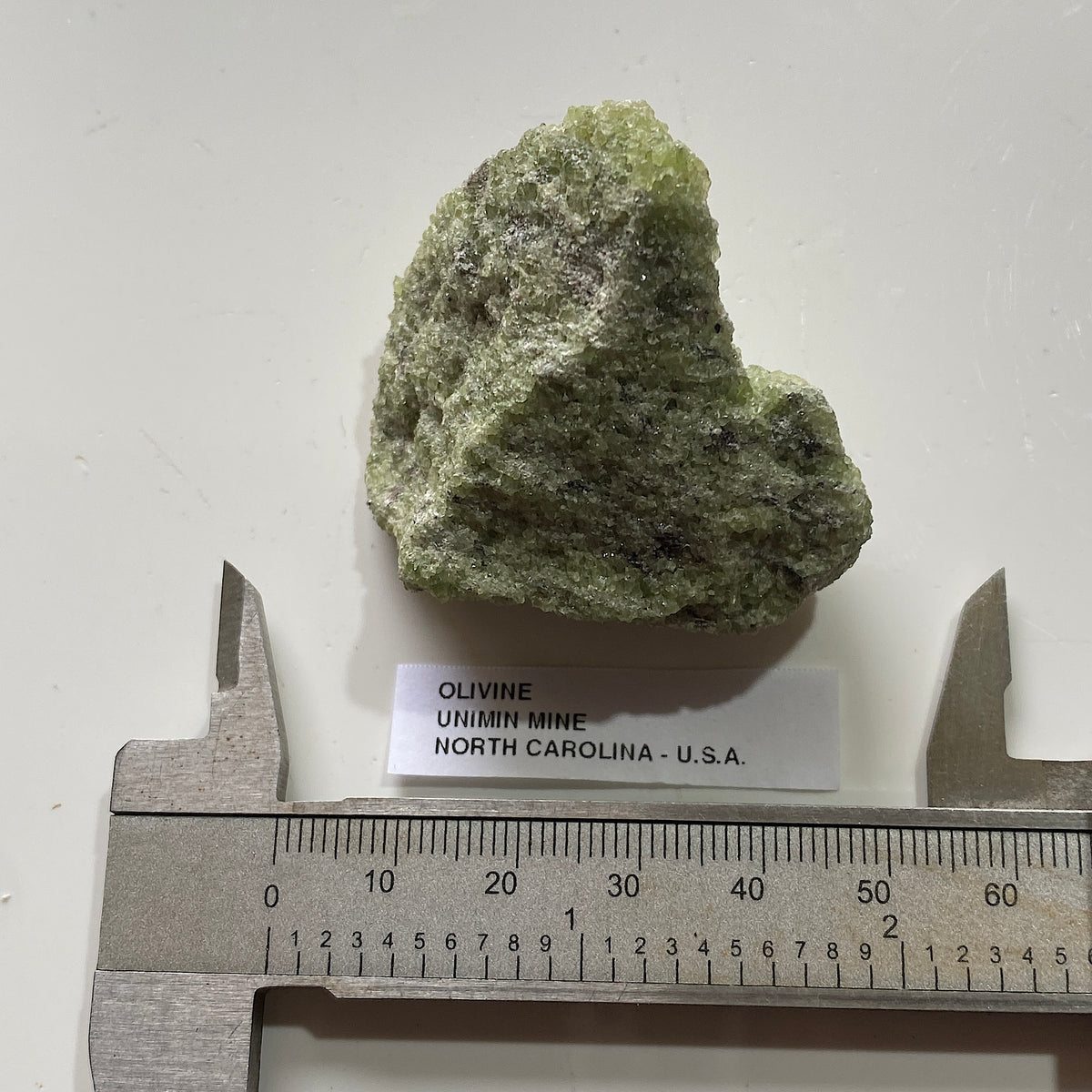 OLIVINE : UNIMIN MINE, YANCY COUNTY, NORTH CAROLINA, U.S.A.  47g. MF5390