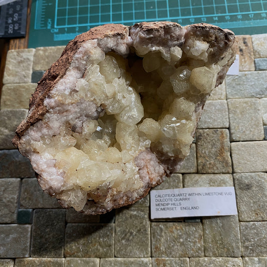 LIMESTONE VUG WITH CALCITE/QUARTZ, DULCOTE, SOMERSET HEAVY 990g MF1491