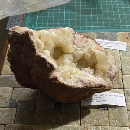 LIMESTONE VUG WITH CALCITE/QUARTZ, DULCOTE, SOMERSET HEAVY 990g MF1491
